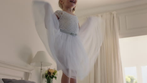 beautiful-little-girl-jumping-on-bed-having-fun-child-in-playful-mood-enjoying-weekend-morning-at-home