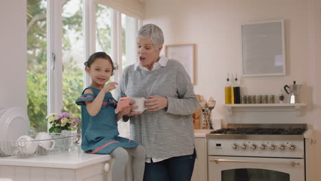 grandmother-and-child-celebrating-success-with-arms-raised-granny-enjoying-teamwork-with-granddaughter-at-home