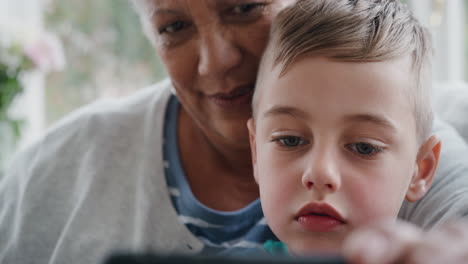 little-boy-using-smartphone-with-grandmother-having-video-chat-waving-at-family-sharing-vacation-weekend-with-granny-chatting-on-mobile-phone-relaxing-at-home-with-grandson-4k