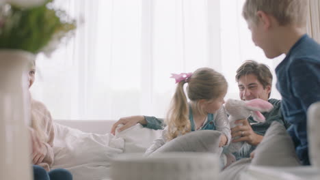 happy-family-having-pillow-fight-mother-and-father-enjoying-playing-with-children-at-home-having-fun-together-on-weekend-4k-footage