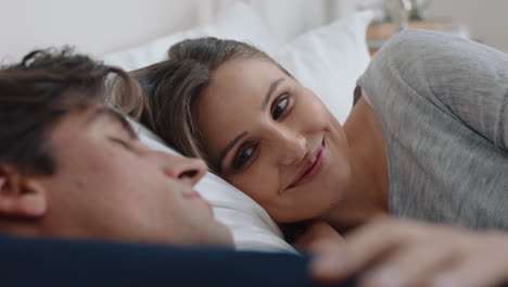 happy-young-couple-lying-in-bed-sharing-romantic-relationship-beautiful-woman-enjoying-intimacy-with-partner-relaxing-together-at-home