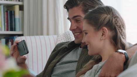 happy-couple-having-video-chat-using-smartphone-chatting-to-friend-looking-surprised-enjoying-online-communication-on-mobile-phone-relaxing-at-home-4k-footage