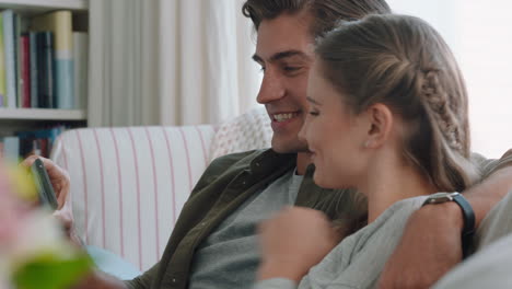 happy-couple-having-video-chat-using-smartphone-chatting-to-friend-looking-surprised-enjoying-online-communication-on-mobile-phone-relaxing-at-home-4k-footage