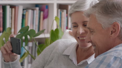 happy-old-couple-having-video-chat-using-smartphone-waving-at-grandchildren-enjoying-chatting-to-family-on-mobile-phone-sharing-lifestyle-relaxing-at-home-on-retirement-4k