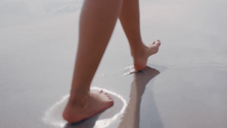 close-up-woman-feet-walking-barefoot-on-beach-enjoying-gentle-wet-sea-sand-female-tourist-on-summer-vacation