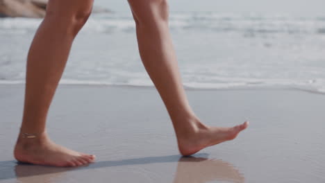 close-up-woman-feet-walking-barefoot-on-beach-enjoying-gentle-wet-sea-sand-female-tourist-on-summer-vacation