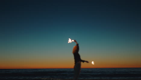 girl-dancing-with-sparklers-on-beach-at-sunset-celebrating-new-years-eve-woman-having-fun-dance-with-sparkler-fireworks-enjoying-independence-day-celebration-by-the-sea