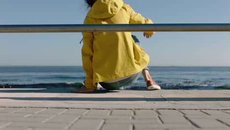 young-woman-relaxing-on-seaside-pier-enjoying-summer-vacation-watching-beautiful-ocean