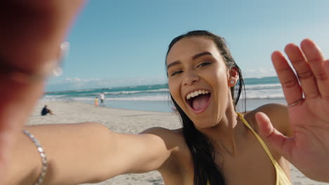 young-mixed-race-woman-having-video-chat-on-beach-girl-blowing-kiss-at-camera-sharing-summer-vacation-using-smartphone-showing-travel-adventure-having-fun-on-holiday