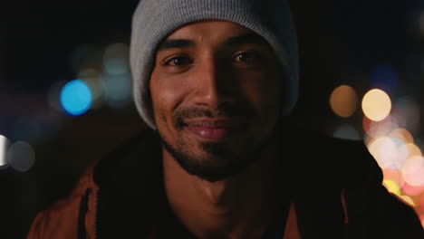 portrait-handsome-hispanic-man-on-rooftop-at-night-smiling-happy-enjoying-urban-nightlife-with-bokeh-city-lights-in-background