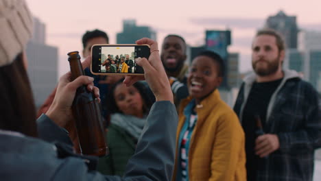 diverse-group-of-friends-posing-for-photo-enjoying-rooftop-party-celebration-having-fun-drinking-alcohol-sharing-weekend-in-city-on-social-media