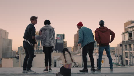 young-group-of-friends-on-rooftop-with-arms-raised-celebrating-enjoying-hanging-out-together-embracing-freedom-at-sunset