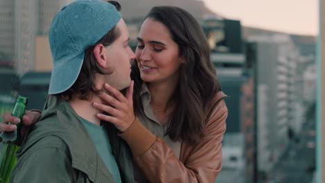 beautiful-caucasian-couple-kissing-on-rooftop-summer-romance-sharing-intimate-connection-hanging-out-on-roof-at-sunet