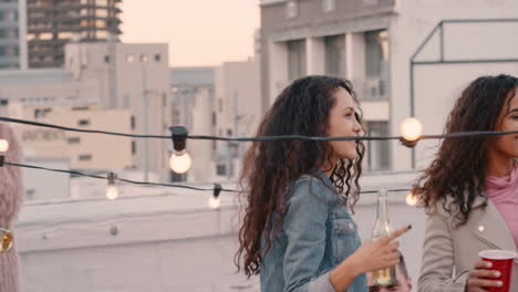 group-of-happy-friends-hanging-out-dancing-together-enjoying-rooftop-party-at-sunset-drinking-having-fun-on-weekend-celebration