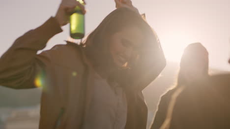 woman-dancing-multi-ethnic-friends--celebrating-on-rooftop-at-sunset-enjoying-party-weekend-having-fun-socializing-hanging-out-drinking