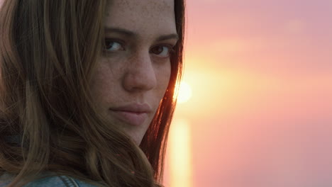close-up-portrait-of-beautiful-young-woman-looking-confident-enjoying-seaside-at-sunset