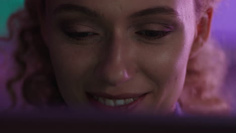 close-up-portrait-beautiful-woman-using-tablet-computer-watching-movie-at-night-looking-at-screen-enjoying-entertainment