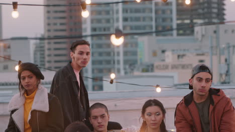 group-of-young-friends-hanging-out-on-rooftop-party-at-sunset-looking-confident-in-urban-city-gen-z-concept