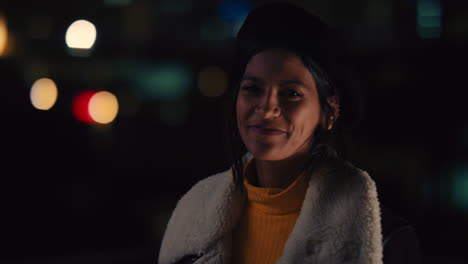portrait-beautiful-mixed-race-woman-on-rooftop-at-night-smiling-happy-enjoying-urban-nightlife-with-bokeh-city-lights-in-background