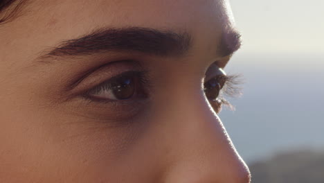 close-up-of-beautiful-eyes-woman-enjoying-view-relaxing-on-summer-vacation-contemplating-future-looking-at-sunny-outdoors