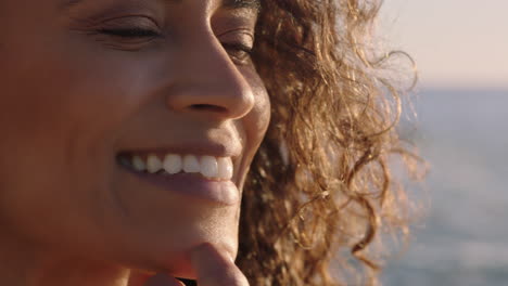close-up-portrait-of-beautiful-happy-woman-enjoying-freedom-exploring-spirituality-feeling-hope-on-peaceful-seaside-at-sunset-with-wind-blowing-hair