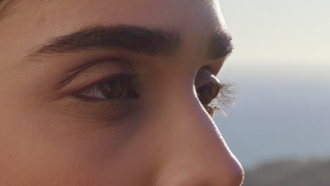 close-up-of-beautiful-eyes-woman-enjoying-view-relaxing-on-summer-vacation-contemplating-future-looking-at-sunny-outdoors