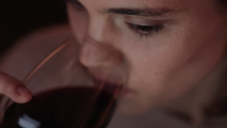 close-up-portrait-happy-woman-using-tablet-computer-watching-movie-at-night-drinking-wine-enjoying-entertainment