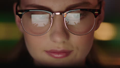 close-up-portrait-beautiful-business-woman-working-late-using-tablet-computer-browsing-financial-graph-data-looking-at-information-on-screen-wearing-glasses