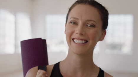 portrait-beautiful-caucasian-woman-laughing-enjoying-yoga-class-practicing-healthy-lifestyle-in-fitness-studio