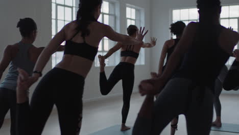 yoga-class-group-of-multiracial-women-practicing-lord-of-the-dance-pose-enjoying-healthy-lifestyle-exercising-in-fitness-studio-instructor-teaching-group-meditation-at-sunrise