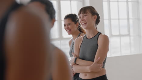 yoga-class-happy-women-friends-chatting-sharing-jokes-having-fun-laughing-in-fitness-studio