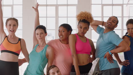 happy-multi-ethnic-group-of-dancers-posing-for-photo-young-woman-photographing-friends-in-dance-class-enjoying-healthy-fitness-lifestyle-together-sharing-video-on-social-media