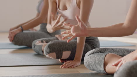 close-up-hands-yoga-women-making-funny-hand-gestures-having-fun-in-fitness-class-enjoying-friendship-connection