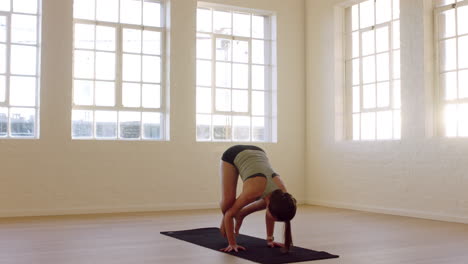 healthy-yoga-woman-practicing-crow-pose-enjoying-fitness-lifestyle-exercising-in-workout-studio-stretching-training-on-exercise-mat-at-sunrise