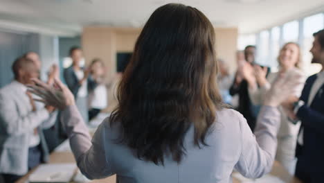 rear-view-business-people-celebrating-congratualting-happy-business-woman-presenting-successful-solution-to-shareholders-clapping-hands-applause-in-office-boardroom-meeting-4k