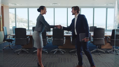 business-people-handshake-in-boardroom-corporate-executives-shaking-hands-partnership-deal-welcoming-opportunity-for-cooperation-in-office-4k