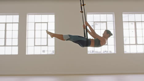 aerial-yoga-woman-practicing-boat-pose-using-hammock-enjoying-healthy-fitness-lifestyle-exercising-in-studio-training-meditation-at-sunrise