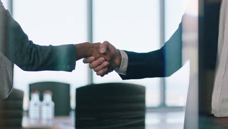 business-people-hanshake-successful-partnership-deal-corporate-executives-shaking-hands-welcoming-opportunity-for-cooperation-in-office-4k-footage