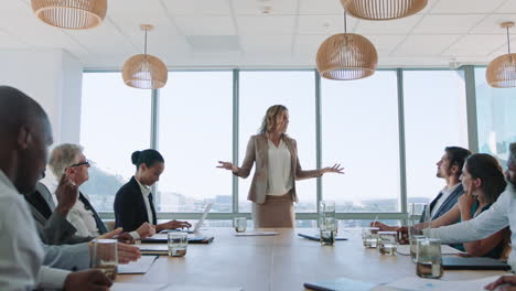 beautiful-business-woman-team-leader-discussing-creative-ideas-with-shareholders-briefing-colleagues-sharing-company-development-strategy-in-office-boardroom-meeting-4k