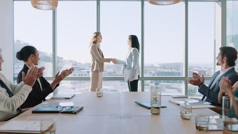 business-women-shaking-hands-in-boardroom-meeting-successful-corporate-partnership-deal-with-handshake-colleagues-clapping-hands-welcoming-opportunity-for-cooperation-in-office-4k