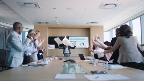 funny-business-woman-celebrating-in-boardroom-successful-corporate-victory-colleagues-throwing-papers-excited-applause-in-office-meeting-enjoying-winning-success-4k
