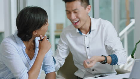 happy-asian-businessman-chatting-to-business-woman-colleague-sharing-funny-joke-laughing-enjoying-having-casual-conversation-in-office-4k