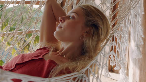 beautiful-woman-in-hammock-enjoying-comfortable-lifestyle-on-vacation-in-holiday-resort-swaying-peacefully-on-lazy-summer-day-in-tropical-paradise-cabin