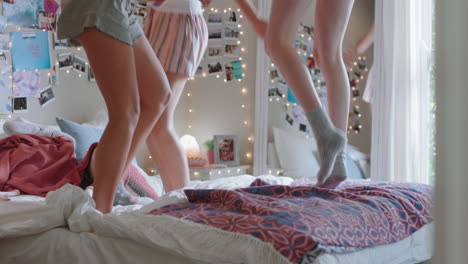 happy-teenage-girls-jumping-on-bed-at-home-best-friends-celebrating-together-enjoying-vacation-weekend
