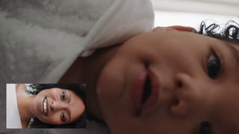 happy-baby-video-chatting-with-mother-on-smartphone-mom-greeting-toddler-enjoying-communicating-with-child-on-video-chat-at-home-vertical-orientation