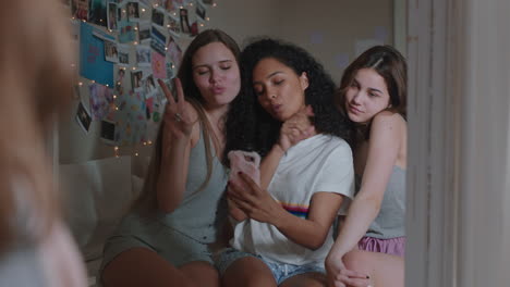 happy-teenage-girls-taking-selfie-photos-together-using-smartphone-best-friends-posing-enjoying-making-faces-hanging-out-at-home-sharing-weekend-on-social-media