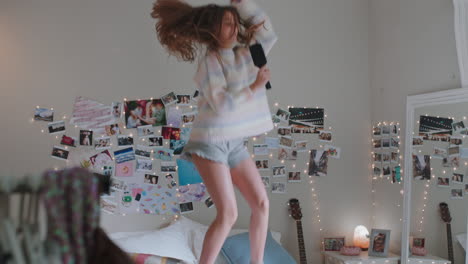 happy-teenage-girl-dancing-on-bed-at-home-to-music-enjoying-celebrating-weekend-having-fun-singing-wearing-pajamas-in-bedroom