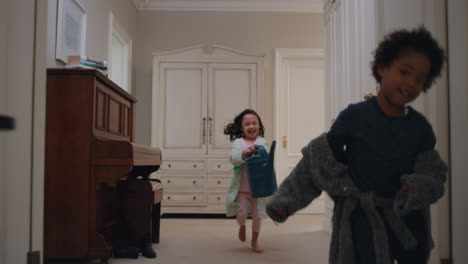 naughty-children-running-through-house-cute-little-girl-smiling-chasing-her-brother-with-watering-can-excited-kids-enjoying-childhood-game-having-fun-on-weekend-morning-wearing-pajamas-4k