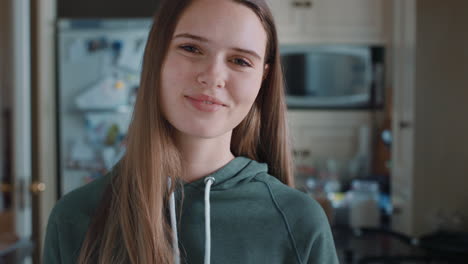 portrait-beautiful-teenage-girl-in-kitchen-at-home-smiling-happy-enjoying-carefree-lifestyle