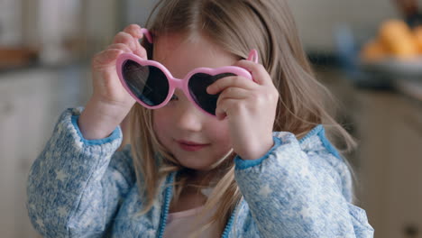 portrait-beautiful-little-girl-wearing-cute-sunglasses-having-fun-at-home-playing-dress-up-enjoying-childhood-imagination